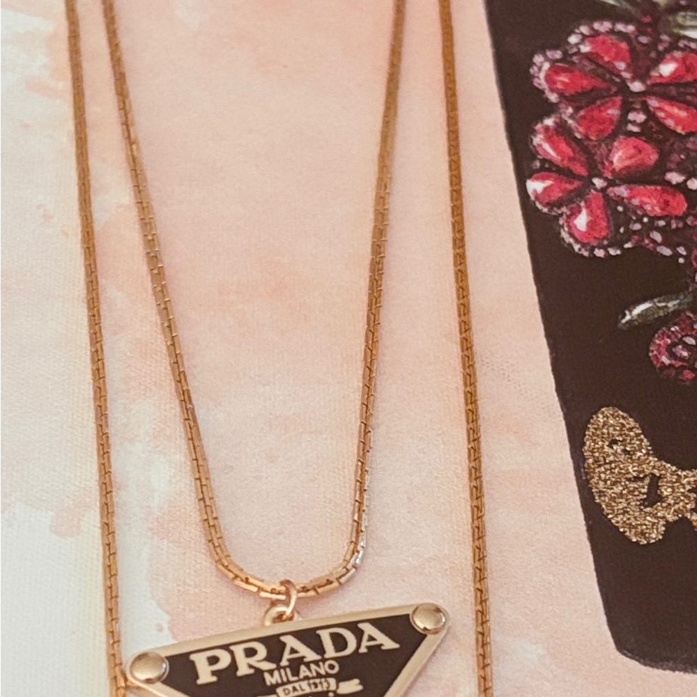 Prada Black and Gold Triangle Logo Pendant Necklace